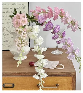 Close-up of pink, purple, and white silk delphinium flowers for home decor