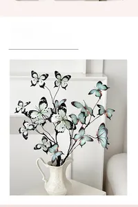Detail of 3D printed butterfly floral branches in white embossed ceramic vase
