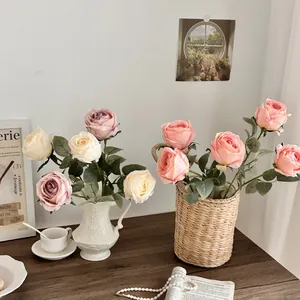 Elegant artificial silk rose bouquet in white ceramic vase for home table decor