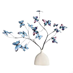 3D printed blue and purple butterfly branch decoration in a white modern ceramic vase