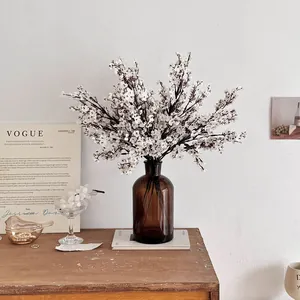 White silk gypsophila artificial flowers in a brown glass vase for home decor