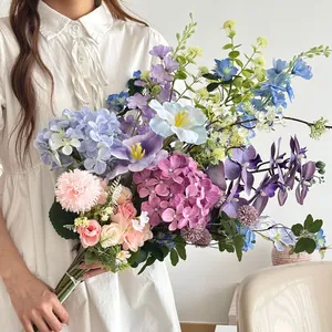 Detailed view of florist artificial bouquet with blue hydrangeas and purple orchids