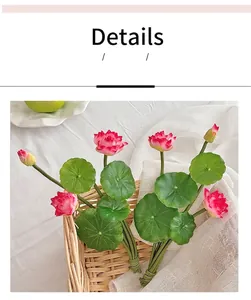 Detail showing artificial pink lotus flowers with green leaves in a woven basket