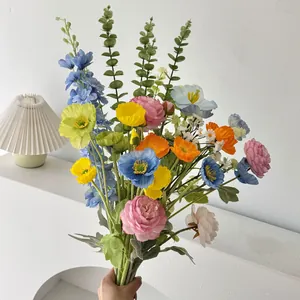 Detail of colorful artificial poppy and peony bouquet with eucalyptus for home decor