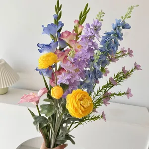 Detail of colorful artificial bouquet with ranunculus and larkspur for home decor