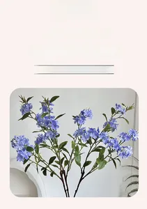 Close-up of artificial purple freesia and hydrangea stems for elegant home vase decoration