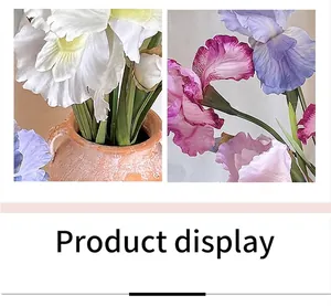 Detail of iris artificial flowers with realistic petals in a rustic ceramic vase