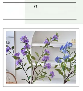 Close-up of artificial purple and blue hydrangea branches with realistic green leaves