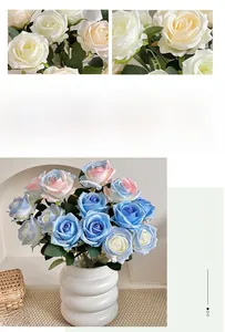 Detail of realistic cream and pink-blue silk rose bouquet in a white ceramic vase