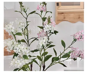 Detailed close-up of realistic white and pink faux hydrangeas in a home decor setting