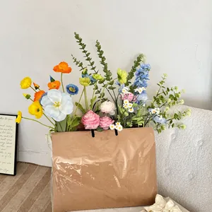 Artistic mix of faux poppies and daisies in a creative kraft paper bag for home decor