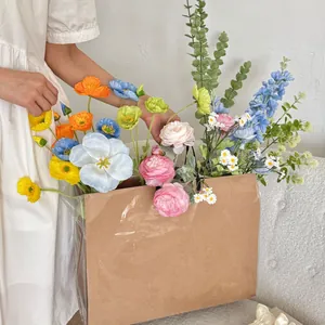 Close-up of colorful artificial flower bouquet in a kraft paper bag with water-proof layer