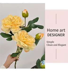Detail of high-quality artificial peony with yellow petals and realistic green buds