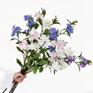 Hand-held bouquet of lifelike artificial Freesia and Hydrangea for home decor