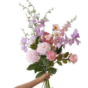 Elegant artificial flower bouquet with pink peonies and lilies for graduation photography
