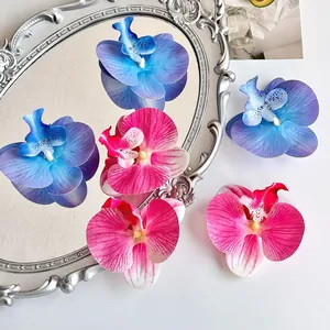 Kunstmatige orchidee bloemhoofdjes in roze en blauw zijde voor DIY decor en ambachten