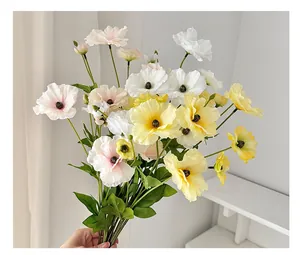 Detail of silk ranunculus bouquet in white, pink, and yellow for home decor