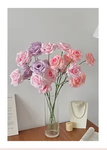 Pink and purple silk artificial roses in glass vase for home floral decoration