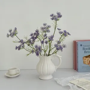 Artificial purple lace flowers in a white ribbed ceramic vase for modern home decor