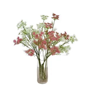 Artificial pink and white lace flowers in a glass vase for home living room decor