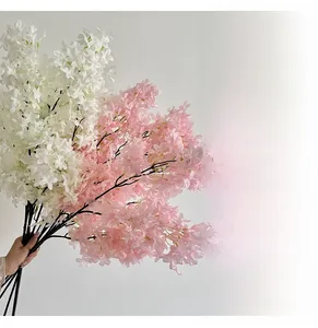 Macro view of realistic silk cherry blossom petals and branches for home decor