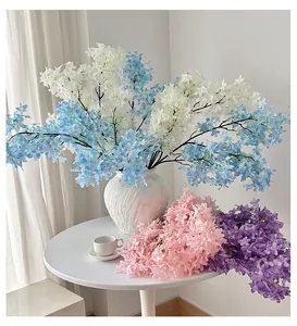 Detailed view of mixed lilac and cherry blossom artificial flowers in four soft colors