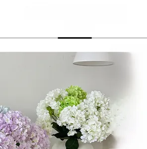 Detailed view of colorful artificial hydrangea petals in a white ripple vase