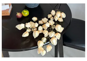Detailed view of cream bell flower artificial bouquet on a dark wooden table decor