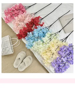 Close-up of assorted artificial lilac flowers in vibrant colors for home decor