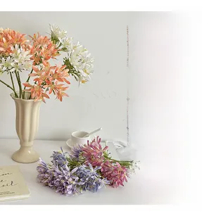 Artistic home decor featuring colorful artificial Agapanthus silk flowers in a vase