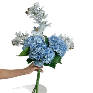 Handheld elegant blue faux bouquet with hydrangeas and orchids for home table decor