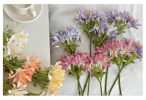 Detailed overhead view of assorted silk Agapanthus flowers in vibrant pastel colors