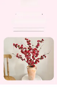 Detailed view of four-forked red plum blossoms in a vintage ceramic vase for home decor