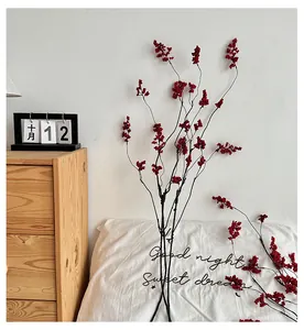 Close-up of red artificial berry stems for Chinese Zen style home decoration and interior design