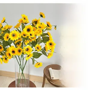 Artificial sunflowers in a clear glass vase for modern home table decor and floral art