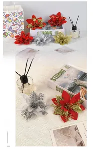 Close-up of artificial Poinsettia Christmas flowers with glitter and hollow details