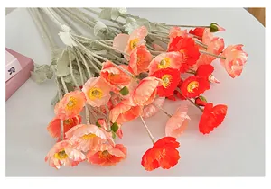 Top view of faux Icelandic poppy bouquet with flocked stems in vibrant red and orange