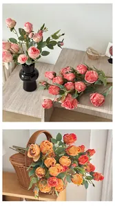 Detail of faux silk roses in pink and orange tones featuring realistic petal textures
