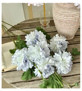 Detailed close-up of realistic white and light blue faux peonies with rich petals