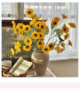 Detailed view of artificial sunflowers in a ceramic vase for home dining table decoration