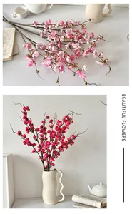 Detail of faux peach blossom branches in pink and red with realistic wooden texture