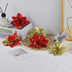 Glitter poinsettia Christmas flowers in red, gold and silver for holiday tree decoration