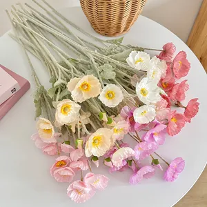 Artificial Iceland Poppy bouquet with flocked stems in vibrant pastel colors on a table
