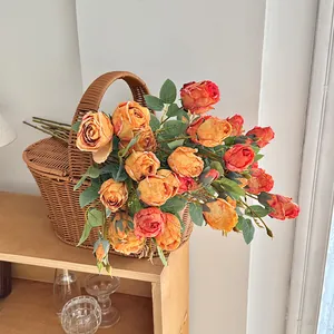 French oil painting style vintage orange silk roses in a rustic woven basket home decor