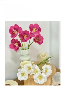 Detailed view of 3D printed pink and white tulips in a green wave ceramic vase