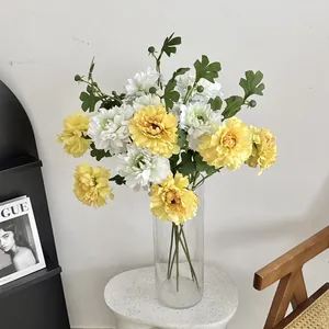 Artificial peony and dahlia bouquet in a clear glass vase for elegant home floral decor