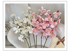 Close-up of 3D printed white orchid with realistic texture and vibrant deep red center