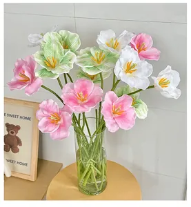 Macro detail of 3D printed pink and white artificial tulips in a glass vase decor