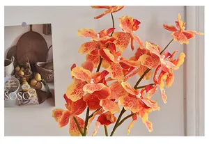 Close-up of 3D printed orange orchid petals with realistic red speckled textures