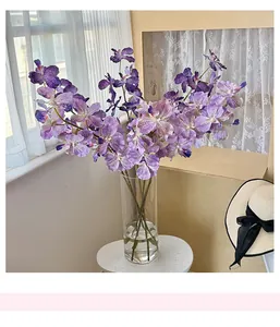 Detailed view of 3D printed purple orchid petals in a clear glass cylinder vase